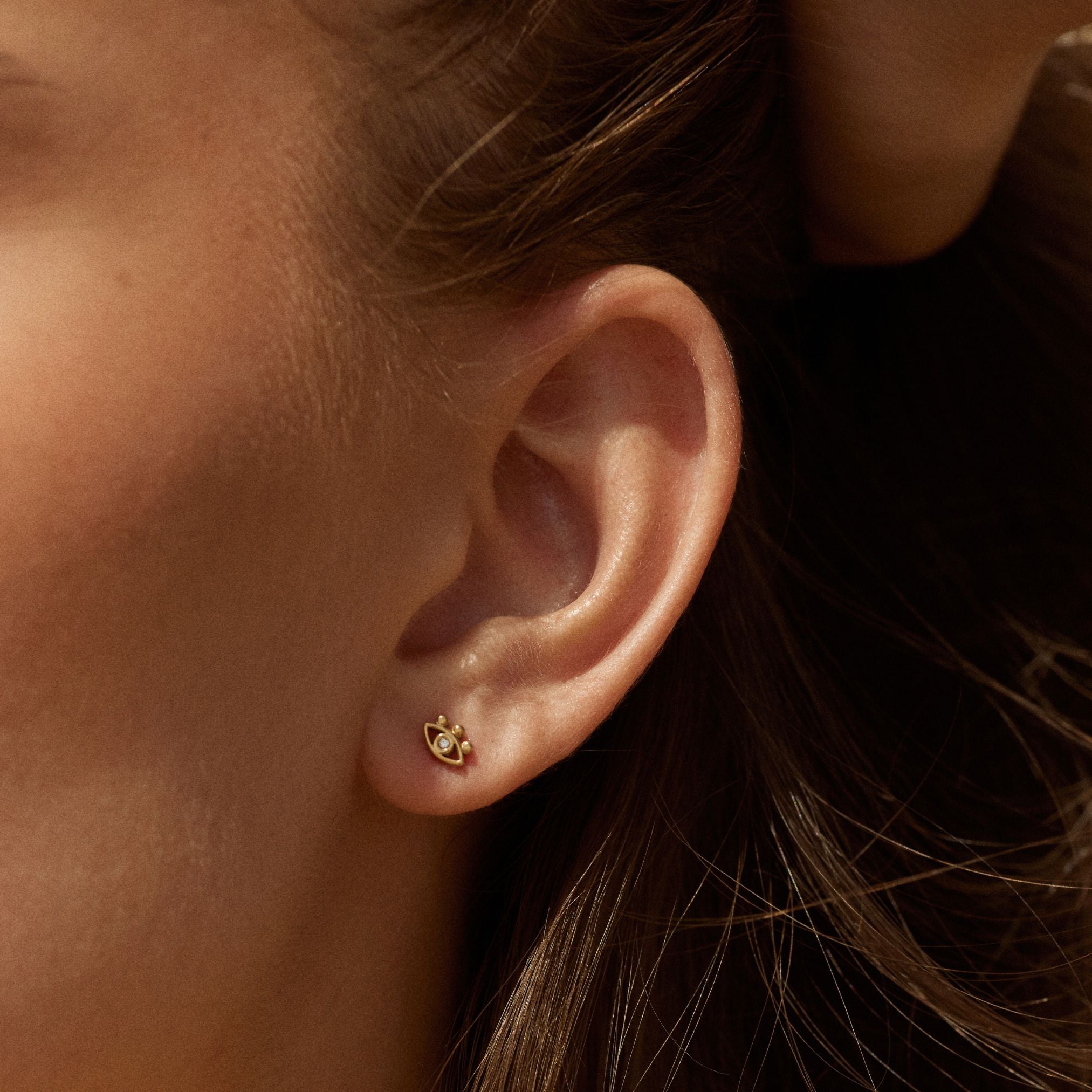 gold-evil-eye-studs Evil Eye Earrings - Image 1