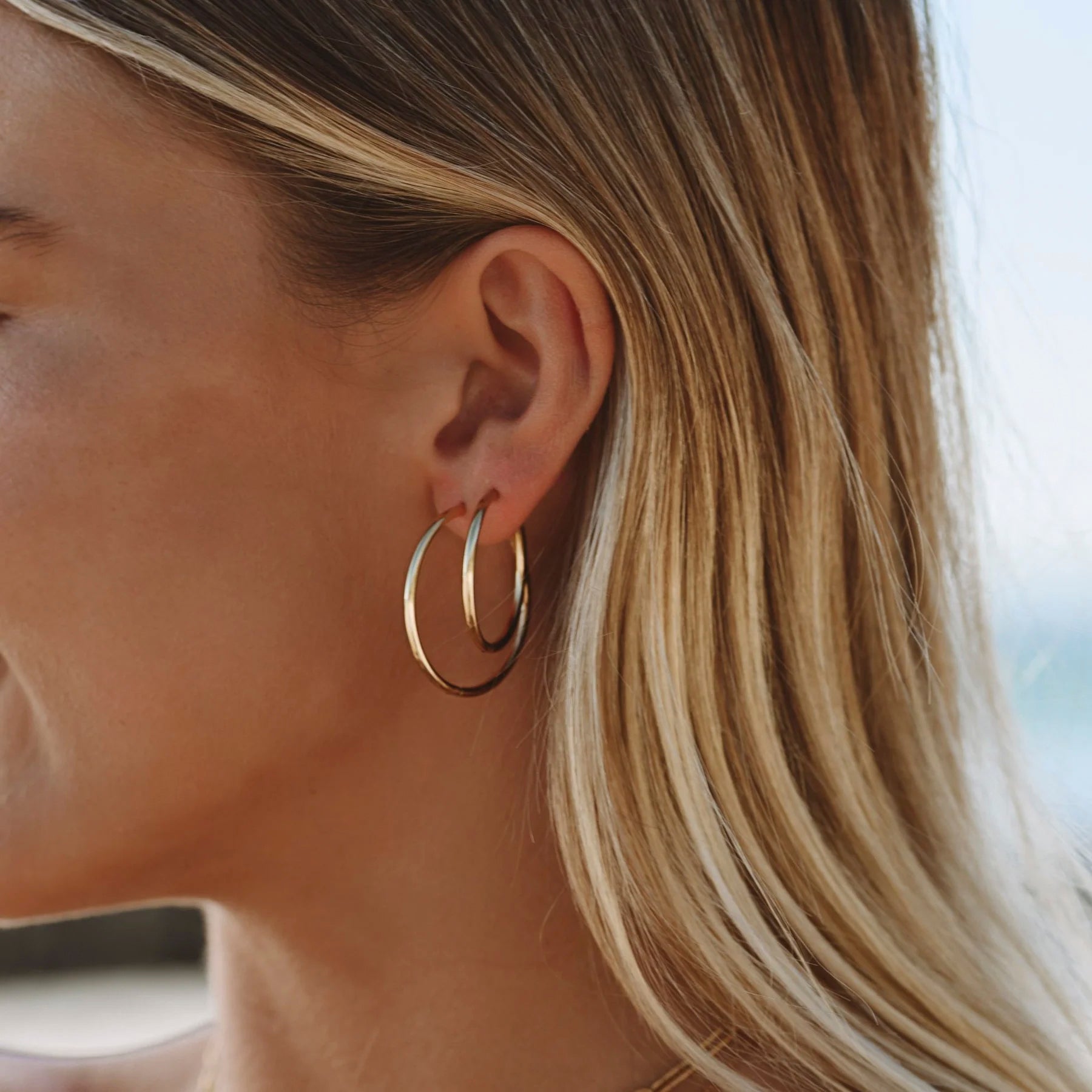 gold-thin-hoop-earrings Thin Hoop Earrings - Image 1